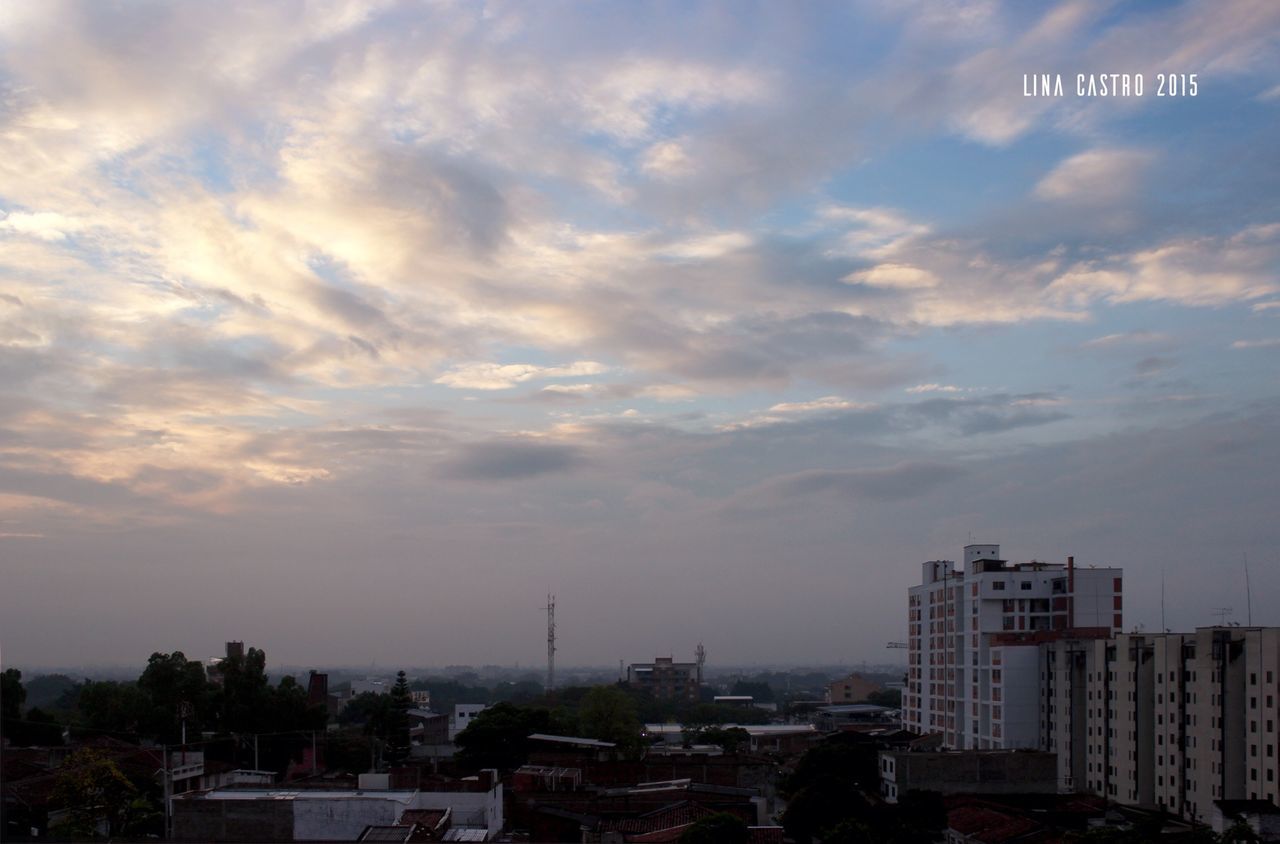 building exterior, architecture, sky, built structure, city, cloud - sky, cityscape, cloudy, residential building, residential district, residential structure, high angle view, cloud, sunset, house, outdoors, town, city life, crowded, no people