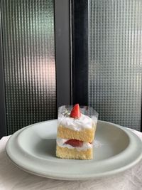 Close-up of cake served on table