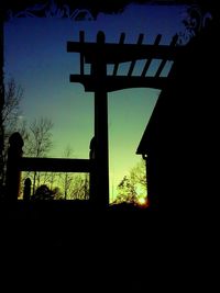 Low angle view of silhouette built structure against sky