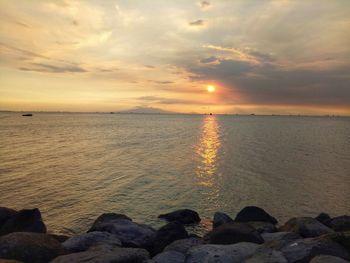 Scenic view of sea against sky during sunset