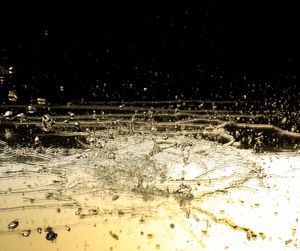 Close-up of snow on water at night