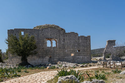 Old ruins against clear blue sky