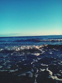 Scenic view of sea against clear sky