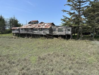 House on field against sky