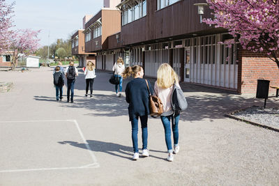 Teenage girls walking together on the move