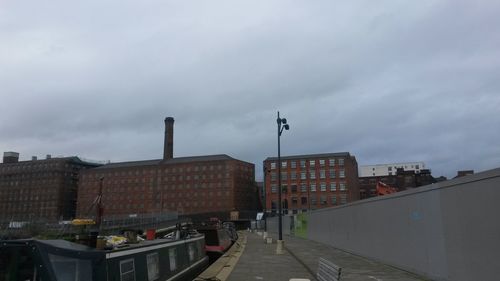 View of city against cloudy sky