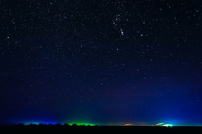 Scenic view of silhouette field at night