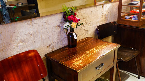 Flower vase on table at home