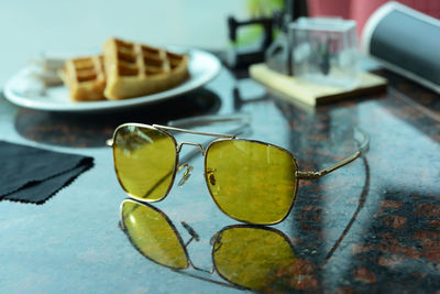 Close-up of sunglasses on table