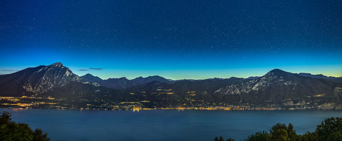 Scenic view of lake garda at night