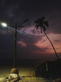 Low angle view of silhouette palm trees against sky during sunset