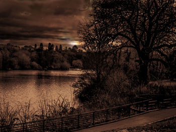 Scenic view of river against sky at night