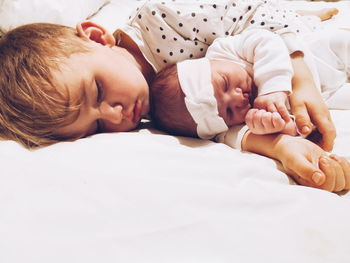 Cute baby sleeping on bed