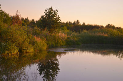 Scenic view of lake against sky during sunset