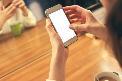 Midsection of woman using mobile phone