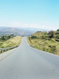 Road amidst landscape against clear sky
