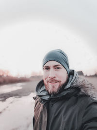 Portrait of young man in snow