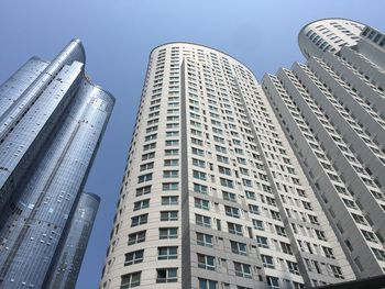 Low angle view of modern buildings against sky