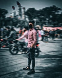 Full length of man standing on road