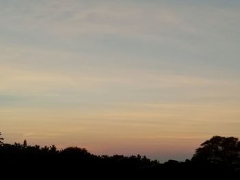 Scenic view of silhouette trees against sky during sunset