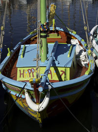 High angle view of sailboats moored in river