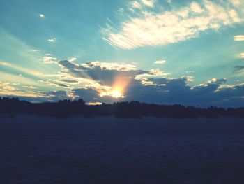 Scenic view of silhouette landscape against sky at sunset