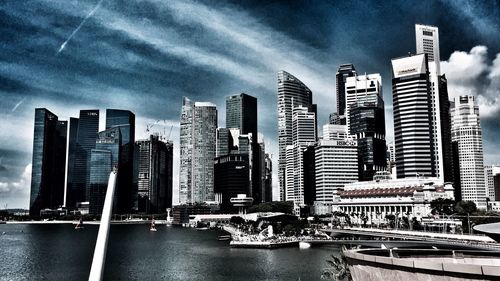 City skyline against cloudy sky