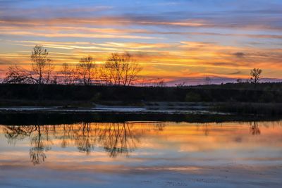 Scenic view of lake during sunset