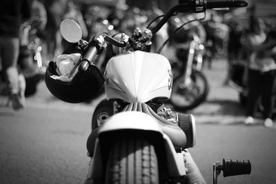 Close-up of motorcycle on road