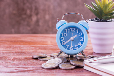 Close-up of clock on table