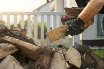 Cropped hand of man working on wood