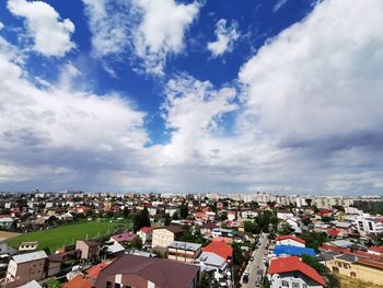 High angle view of townscape against cloudy sky