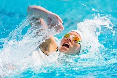 Portrait of man swimming in pool