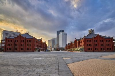 Buildings in city at sunset