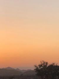 Scenic view of silhouette mountain against sky during sunset