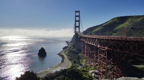 Bridge over sea against sky