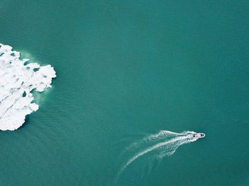 Aerial view of boat sailing on sea