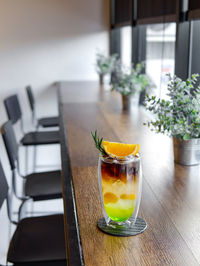 Orange juice in glass on table
