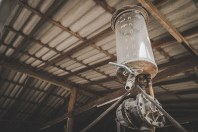 Low angle view of old light bulbs hanging from ceiling