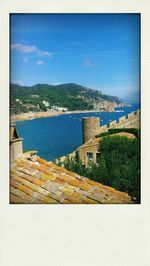 Scenic view of sea against blue sky