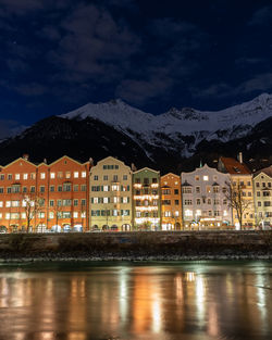 Reflection of buildings in city at night