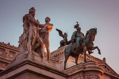 Low angle view of statue against sky