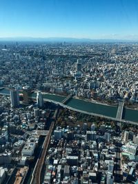 High angle view of illuminated city against clear sky