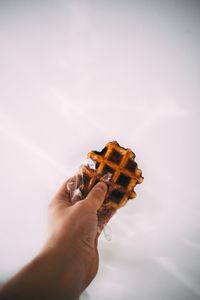 Close-up of hand holding ice cream