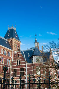 Low angle view of building against blue sky