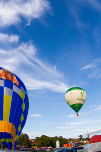 Low angle view of hot air balloon against blue sky