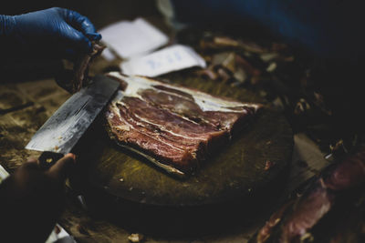 Cropped hand of person preparing food