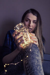 Portrait of beautiful woman sitting at home