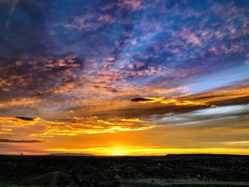 Scenic view of dramatic sky during sunset