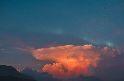 Low angle view of dramatic sky at night